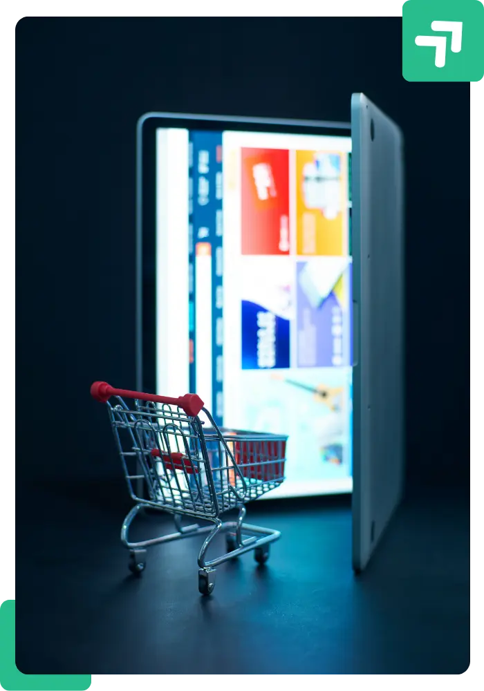 a laptop and card depicting a website created by shopify web developer
